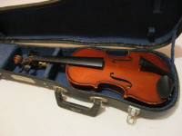 Tiny violin in case