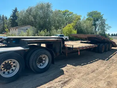 Year 2002 Model lowboy 42 feet long Air bag Hauling equipment Tilt trailer Good running CVIP exp Aug...