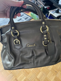 Woman brown gray coach handbag