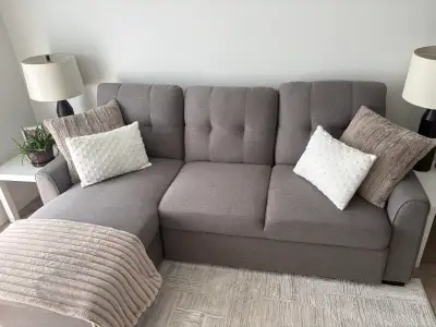 Sectional couch with sleeper and storage, like new barely used. Asking $1000 obo, need gone. Origina...