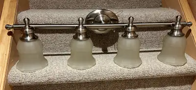 Brushed nickel vanity lights. Frosted globes., View more