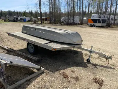 12 foot aluminum trailer with off loading from the back or off each of the front V sides. Trailer wo...