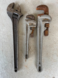 Pipe wrenches and adjustable