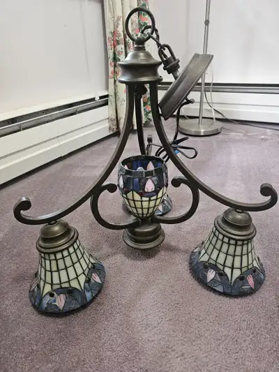 Tiffany 4 light ceiling fixture in very good condition. Shades of pinks and blues with ruby red acce...