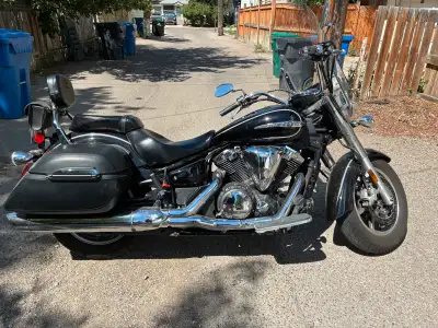 2014 Black Yamaha V-star 1300, soft bags, 11,069 kilometers. Good condition.
