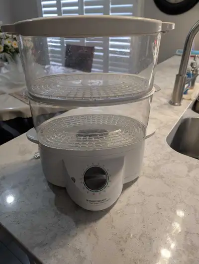 2 levels for steaming vegetables.. Used. Smoke and pet free home