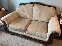 Solid love seat with wood detailing in great condition