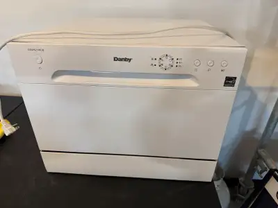 White energy star portable countertop dishwasher. 6 place setting, silver ware basket, 6 programmabl...