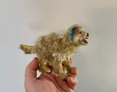 Crafted with self hardening clay, and craft fur. Painted with acrylics. A cute GoldenDoodle! to add...
