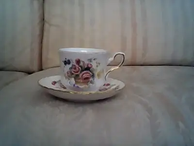 Now on sale is this elegantly beautiful English bone china teacup and saucer by Royal Stafford in a...