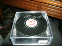 Autographed Calgary Flames puck by Andrew Mangiapane