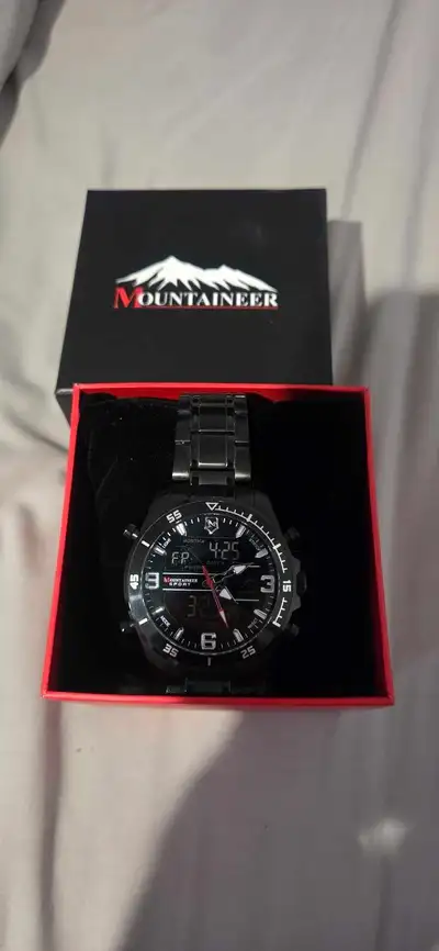 Sleek black Mountaineer Sport watch. Dual analog and digital display. Comes in original box. Great f...