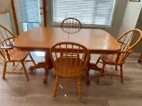 Solid wood table with leaf and 4 chairs.