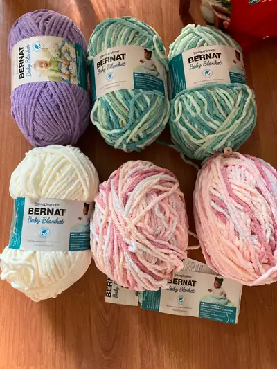 Lot of 11 bernat blanket yarn…regular, pet and baby. .Selling as a lot, not separately. 11 for $110....