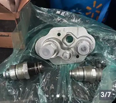 Bobcat coupler & 2 filters new in box . Take all for $500