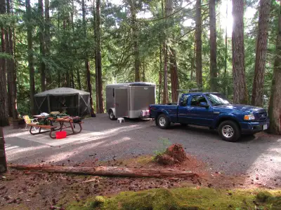 Cargomate Enclosed Trailer/Camper The trailer is a 2012 Cargomate 10X6X6’2” single-axle unit, made i...