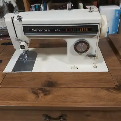 KENMORE  SEWING  MACHINE WITH MACHINE STAND, View more