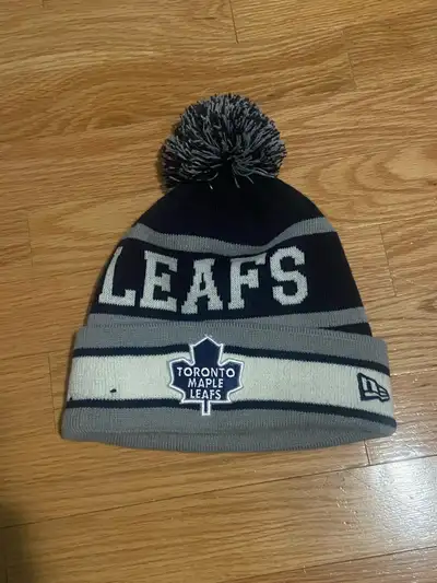 Toronto Maple Leafs NHL Hockey Blue Adult SIZE Beanie Toque With Pompom Stay warm and show off your...
