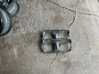 69 Chev Beaumont headlight bezels (pair). Small amount of pitting but will clean up nicely.. $100 pa...