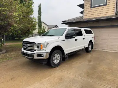 2020 F150 XLT, has a 2” lift with 33” Good year duratrac tires at about 80% left. Has had seat cover...