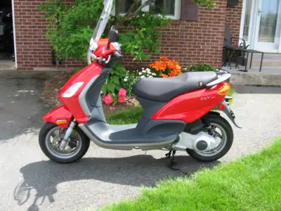 Scooter is in excellent condition with very few kms on it. Has Piaggio windshield with it. Piaggio m...