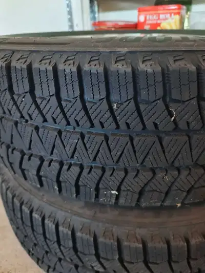 Rarely used 225/65 R17 Bridgestone with Rims with very low mileage winter driving. This set was purc...