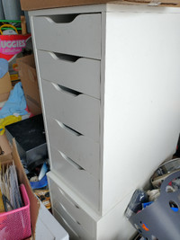 one Ikea white drawer unit