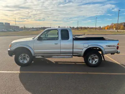 2004 Toyota Tacoma off road 5 speed manual 4x4 V6 Set of studded winter tires on rims Power windows...