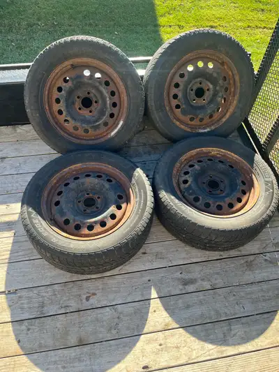 Well used snow tires and rims off of a Ford Eacape. See pics for size and condition. Located in Jane...