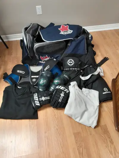 GREAT CONDITION EQUIPMENT FOR SALE! SELLING ALL ITEMS AS A SET. 1 - Canada Hockey Bag with Wheels 1...