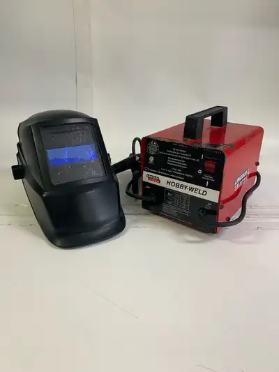 Lincoln Electric Hobby-Weld Stick Welder package. Comes with: * Auto-Darkening Welding Helmet * Elec...