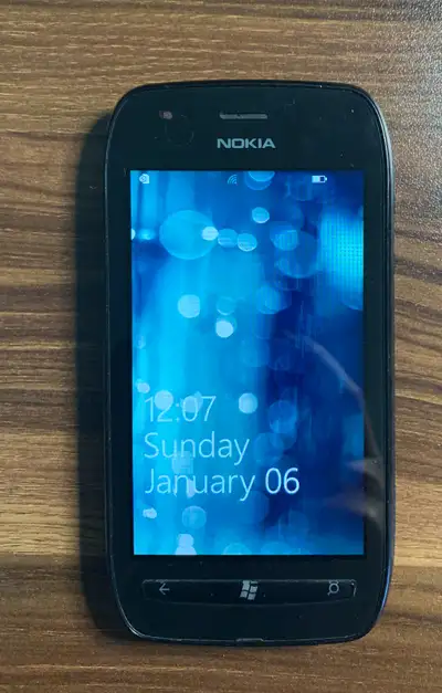 Used black Nokia Lumia 710. Phone is in good condition, gently used, has some scratches on the back...