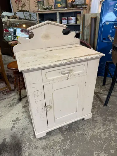 Great vintage wooden cabinet with great back piece. Solid wood. Mounted on wheels to easily move it...
