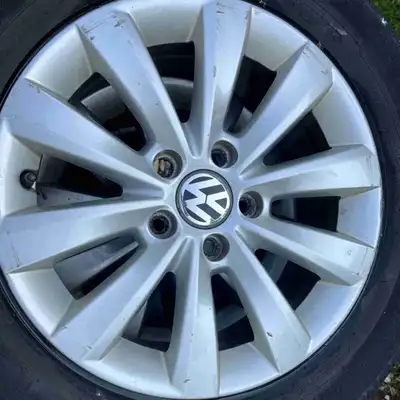 For sale is a set of used Volkswagen rims with tires, size 215/60R16. These rims and tires came off...