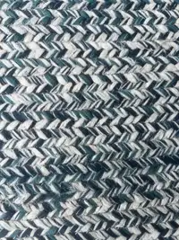 Blue and white woven outdoor rug