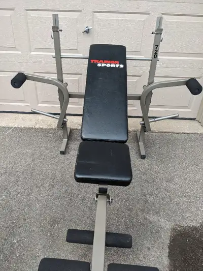 Trainor sports folding weight bench with leg extension for sale in good condition. Bench is adjustab...
