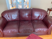 Red leather couch and love seat. Pick up in mount pearl.