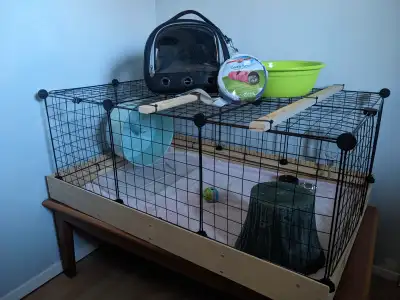 Cage for pocket pet, metal panels for top and sides with wooden base. Dimensions: 1ft high, 2ftx3ft...