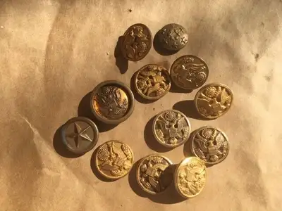 A group of 12 US Military buttons. Waterbury the maker on some. Based on the back several are really...