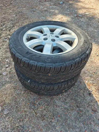 2- 225/65R17 Honda Alloy Rims and tires, tires aren't good rims are in great shape. Bolt pattern 5x1...