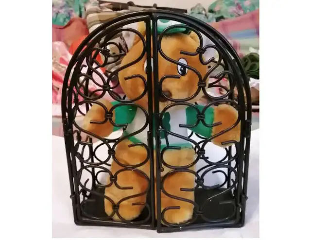 Heavy gauge wired black metal cage teddy bear doll