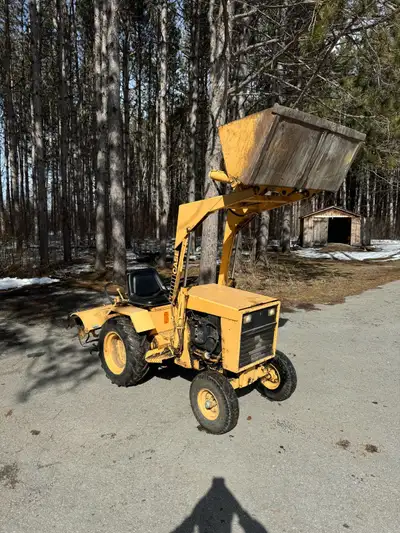 Two cylinder case farm tractor for sale with Rototiller attachment and loader bucket can deliver for...