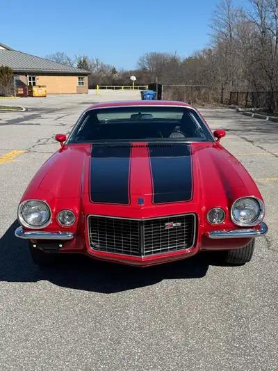Here for Sale is a true 1970 RS Z28 Cranberry Red Camaro. A Canadian GM documented car. The vehicle...