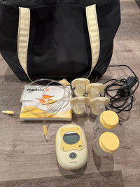  Medela Freestyle breast pump with a brand new pair of pers