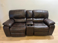 Reclining leather love seat with storage