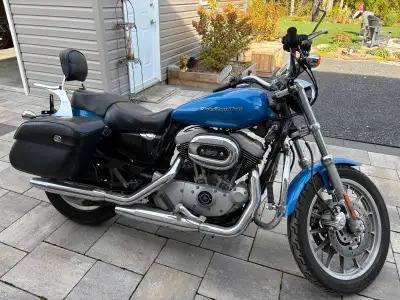 2004 Harley Davidson Sportster XL 1200R with only 95,245 kms. Comes with engine guards, saddle bags...