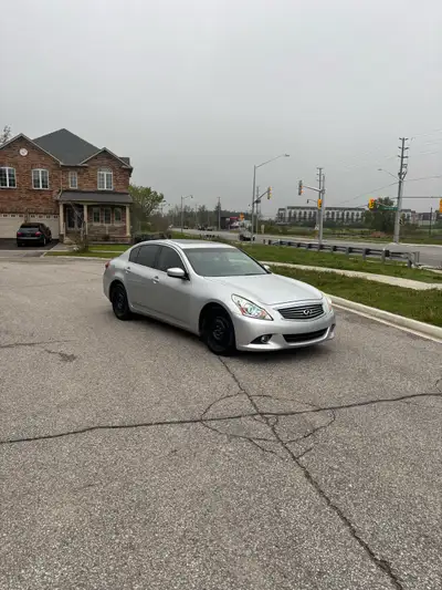 This is a 2012 Infiniti G37 sedan, featuring a powerful engine and a sleek design. The car is in use...