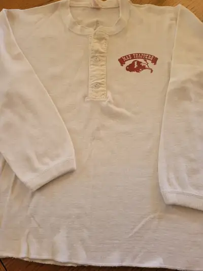 Shirt is from the Mad Trapper Restaurant that was in Calgary back in the 1970's/80's Made by Buffalo...