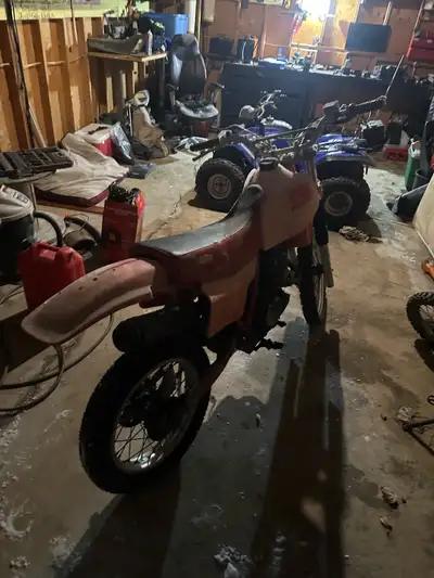 Need some pieces for carbs but runs off starter fluid. Shocks soft! Front brake sticky. 1983 Suzuki...