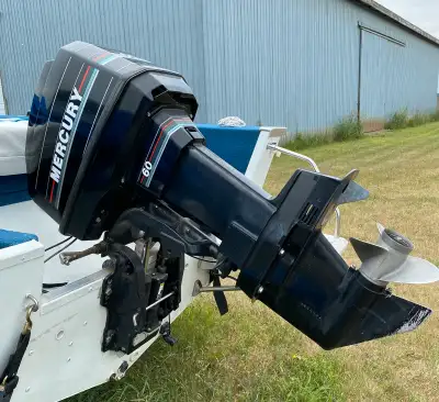Spectrum 60hp Mercury (tilt) Matching Trailer Included.